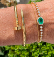Diamond bolo bracelet with emerald. In stock