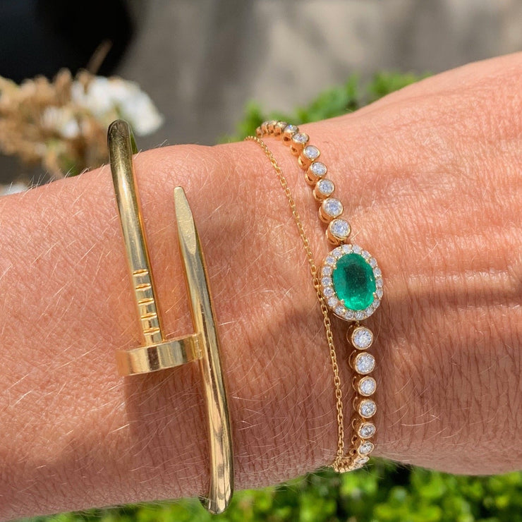 Diamond bolo bracelet with emerald. In stock